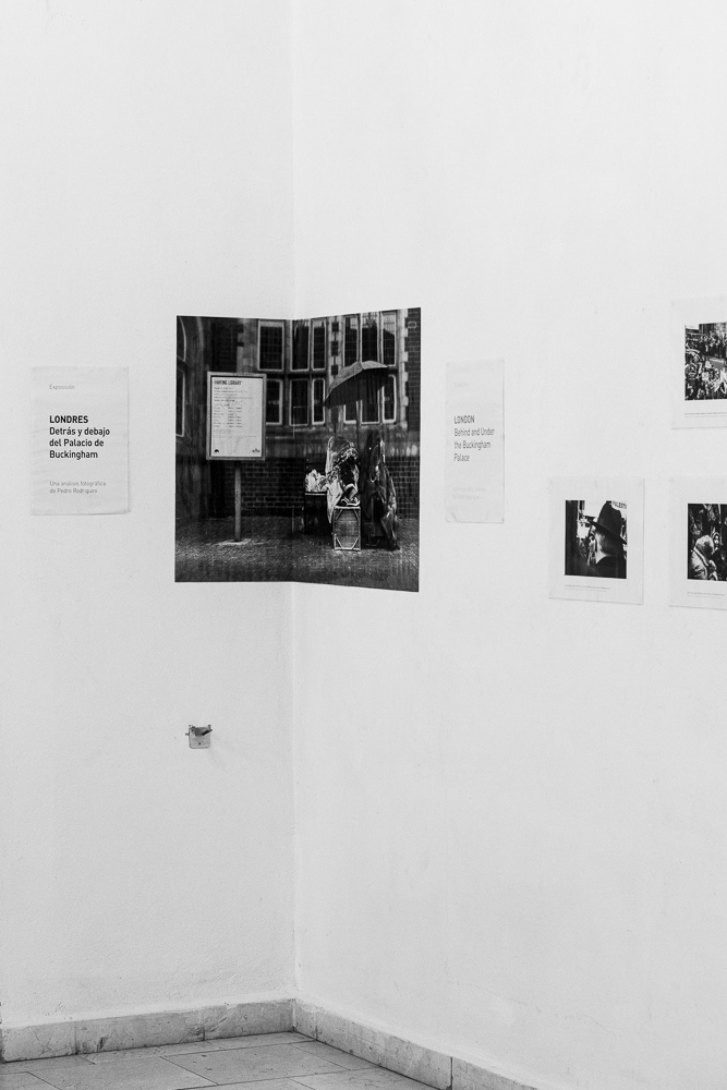 Picture of the frames on the exhibition wall with the caption cheap Black and white Laser printing, A3 plastification and a ridiculous amount of blue-tack in action!  gallery arte soy in santiago de cuba, cuba. 2015  © Pedro Rodrigues